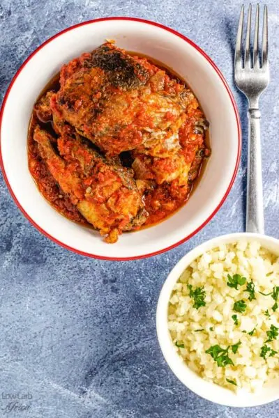 West African Fish Stew in a pot with tomatoes, peppers, and palm oil, a bold Ghanaian and Nigerian fish dish