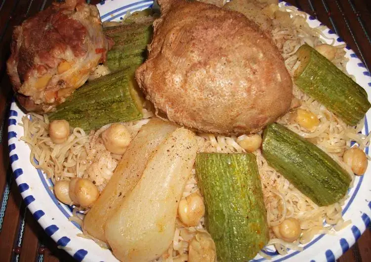 Algerian Rachta thin handmade noodles with lamb stew and chickpeas in a bowl, a traditional Algerian celebration dish