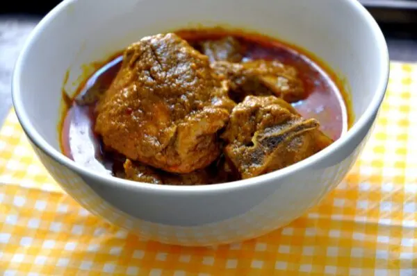 Banga Soup Nigerian palm nut soup served with starch or pounded yam, a rich Niger Delta dish made with palm fruit and banga spices