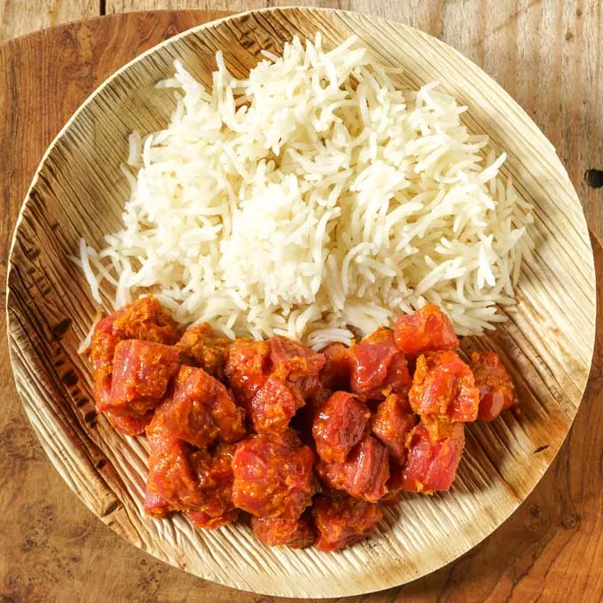 Gored Gored Ethiopian raw beef cubes tossed in niter kibbeh and berbere served on injera, a traditional Ethiopian delicacy