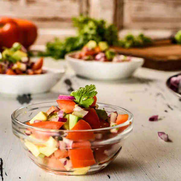 Kachumbari East African tomato and onion salsa in a bowl with chilli and coriander, Kenya's essential fresh side dish