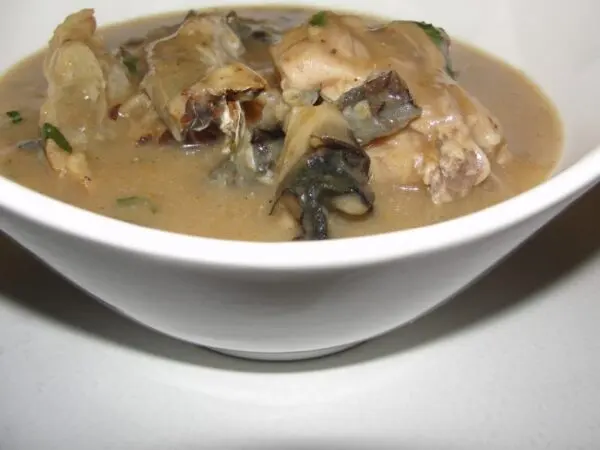 Ofe Nsala white soup served with catfish and pounded yam, a traditional Nigerian soup from the riverine communities of Anambra State