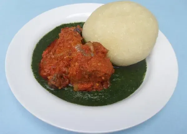 Amala lafun with ewedu soup, a Yoruba pairing of white cassava swallow and jute leaf soup