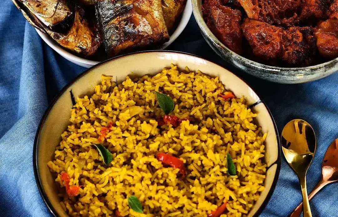 Banga rice, Nigerian rice cooked in palm fruit extract with prawns and smoked catfish