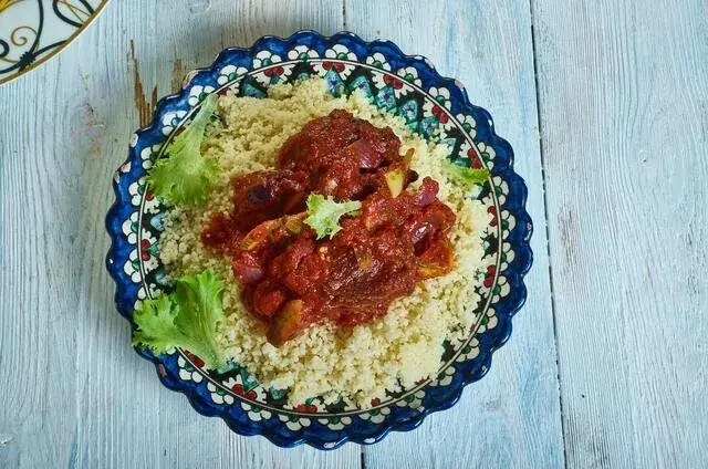 Bassi salté, Senegalese millet couscous with meat, vegetables and raisins