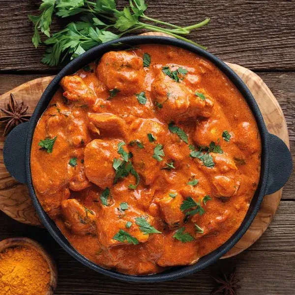 Butter chicken in a spiced tomato and butter sauce with flaked almonds