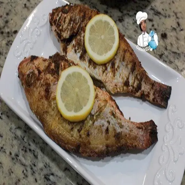 Whole red snapper marinated in chimichurri and grilled