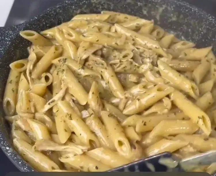 Creamy penne pasta with shredded chicken, peppers and melted mozzarella