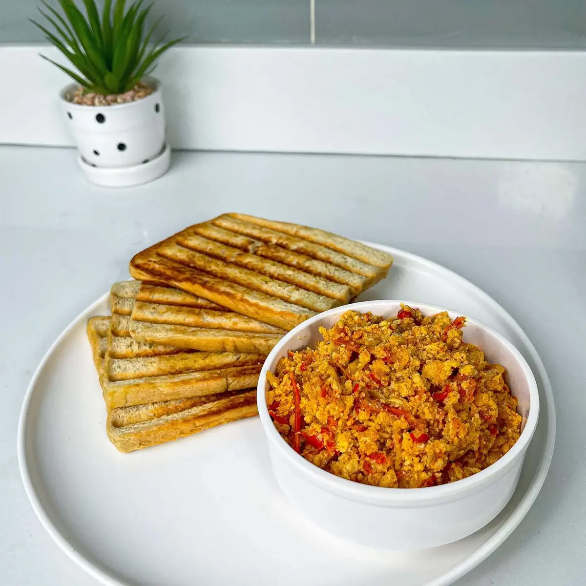 Egg sauce, Nigerian eggs scrambled through a tomato, onion and pepper base