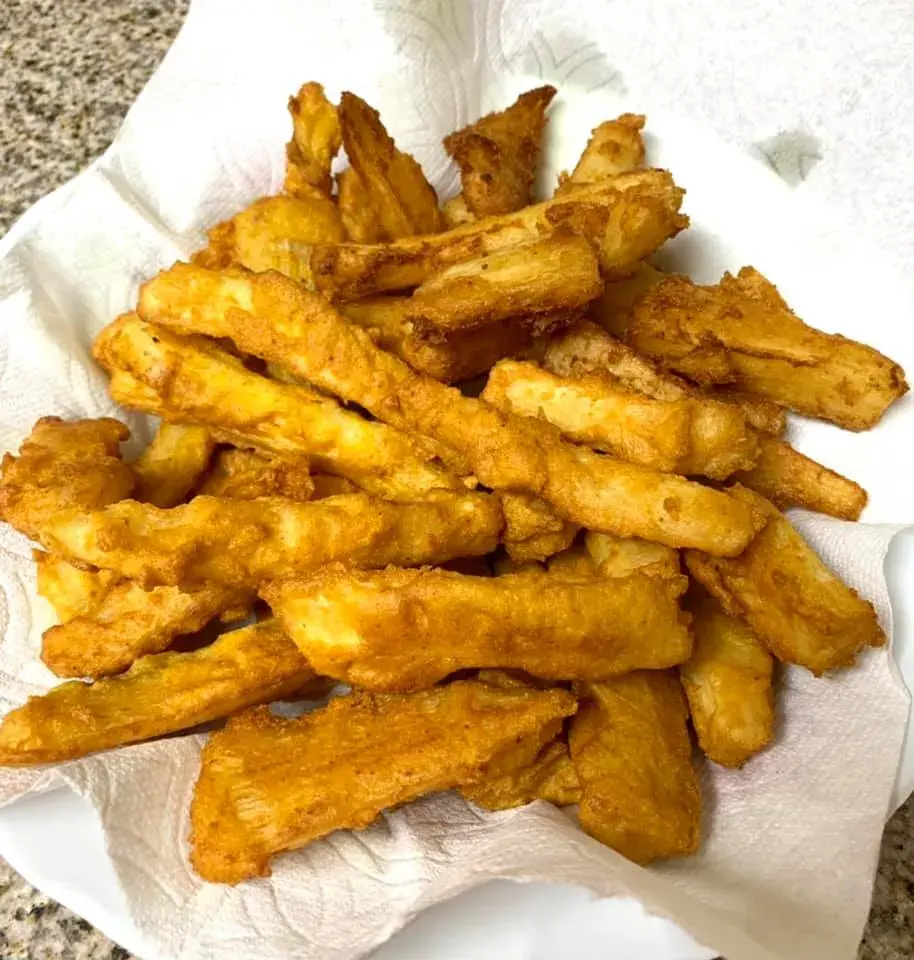 Fried cassava, golden crisp yuca pieces sprinkled with salt