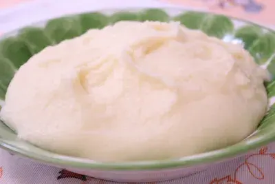 Funge, an Angolan cassava porridge, shaped into a smooth mound and served warm