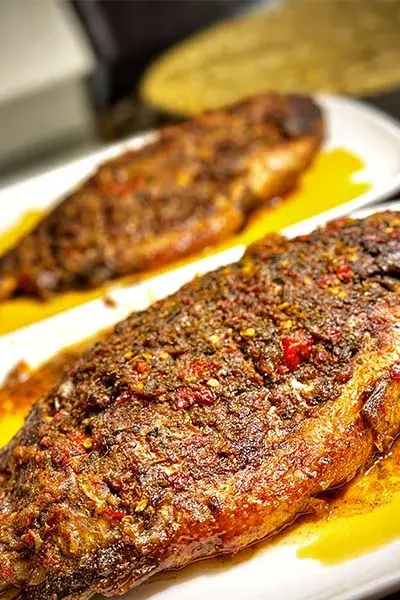 Grilled tilapia with a green pepper, herb and ginger base