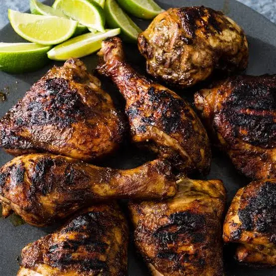 Jerk chicken marinated in scotch bonnet and allspice, grilled