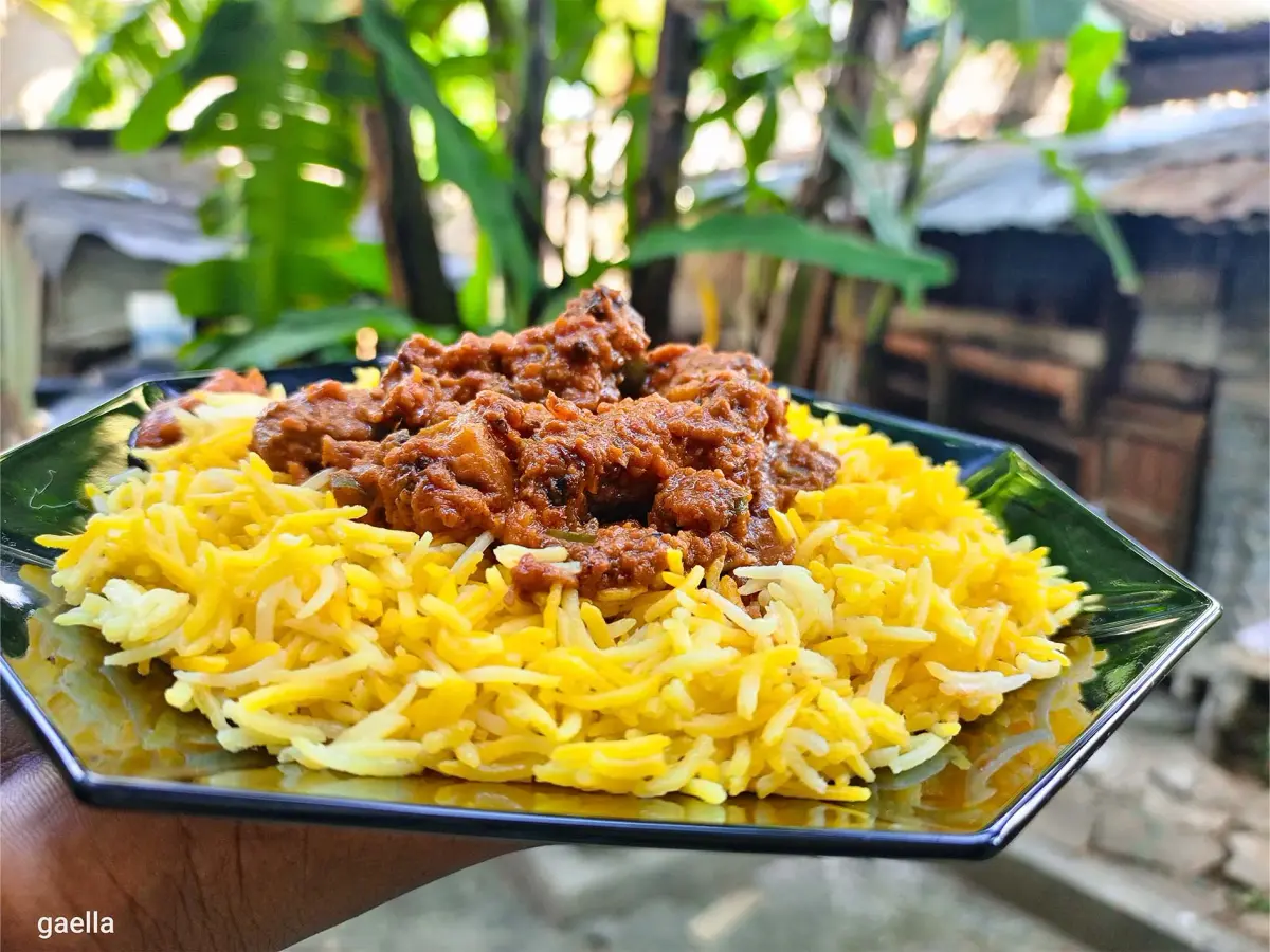 Kenyan beef biryani, layered spiced beef and basmati rice with fried onions and potatoes
