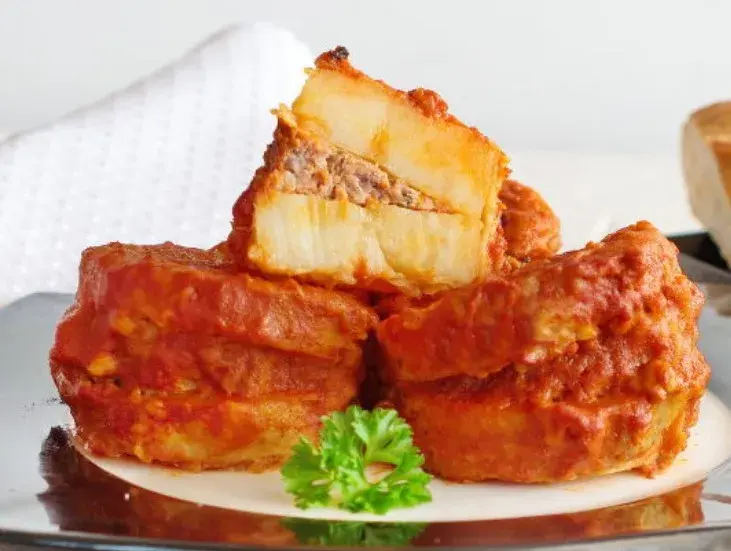 Libyan mafrum, potato parcels stuffed with spiced beef in a red tomato sauce