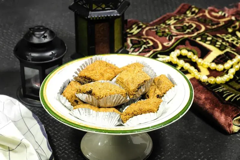 Makroud, diamond-shaped North African semolina pastries soaked in honey syrup