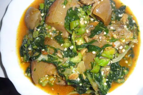 Okro soup, a Nigerian okra soup with assorted meat and smoked fish, served with a swallow