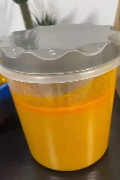 Palm fruit juice, the thick orange extract pressed from boiled palm fruit for West African soups