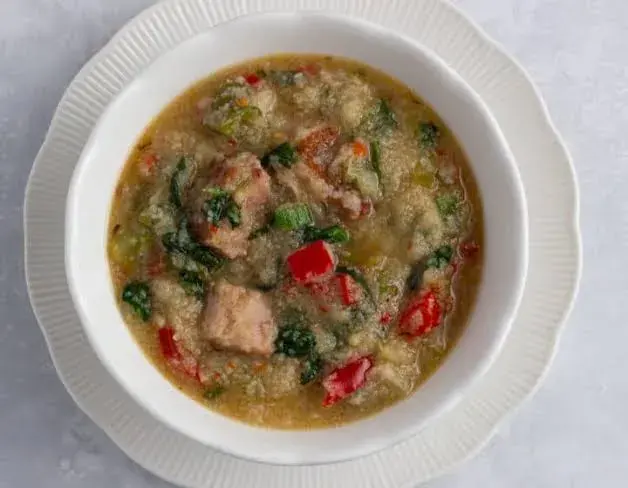 Pate, a Northern Nigerian one pot grain porridge with kenaf leaf, meat and groundnut