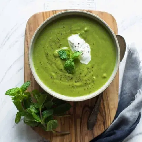Pea and mint soup finished with buttermilk and whole peas