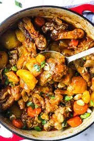 Pig feet stew, trotters slow cooked in a thick tomato and pepper sauce