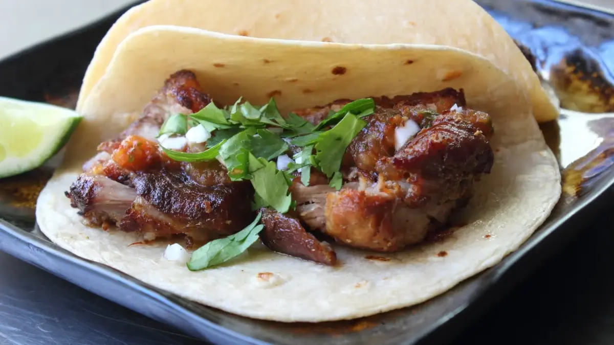 Pork carnitas braised in milk and orange, crisped at the edges