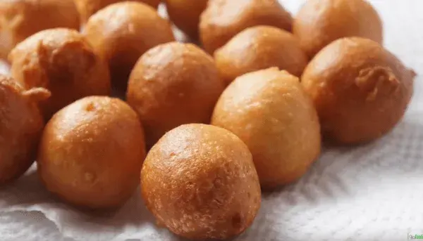 Puff puff, golden West African fried yeast dough balls served hot