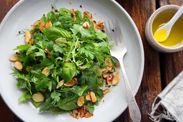 Purslane and herb salad with goat cheese and walnuts
