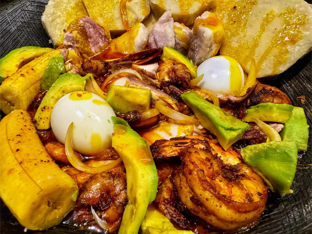 Seafood garden egg stew with prawns, smoked mackerel and palm oil