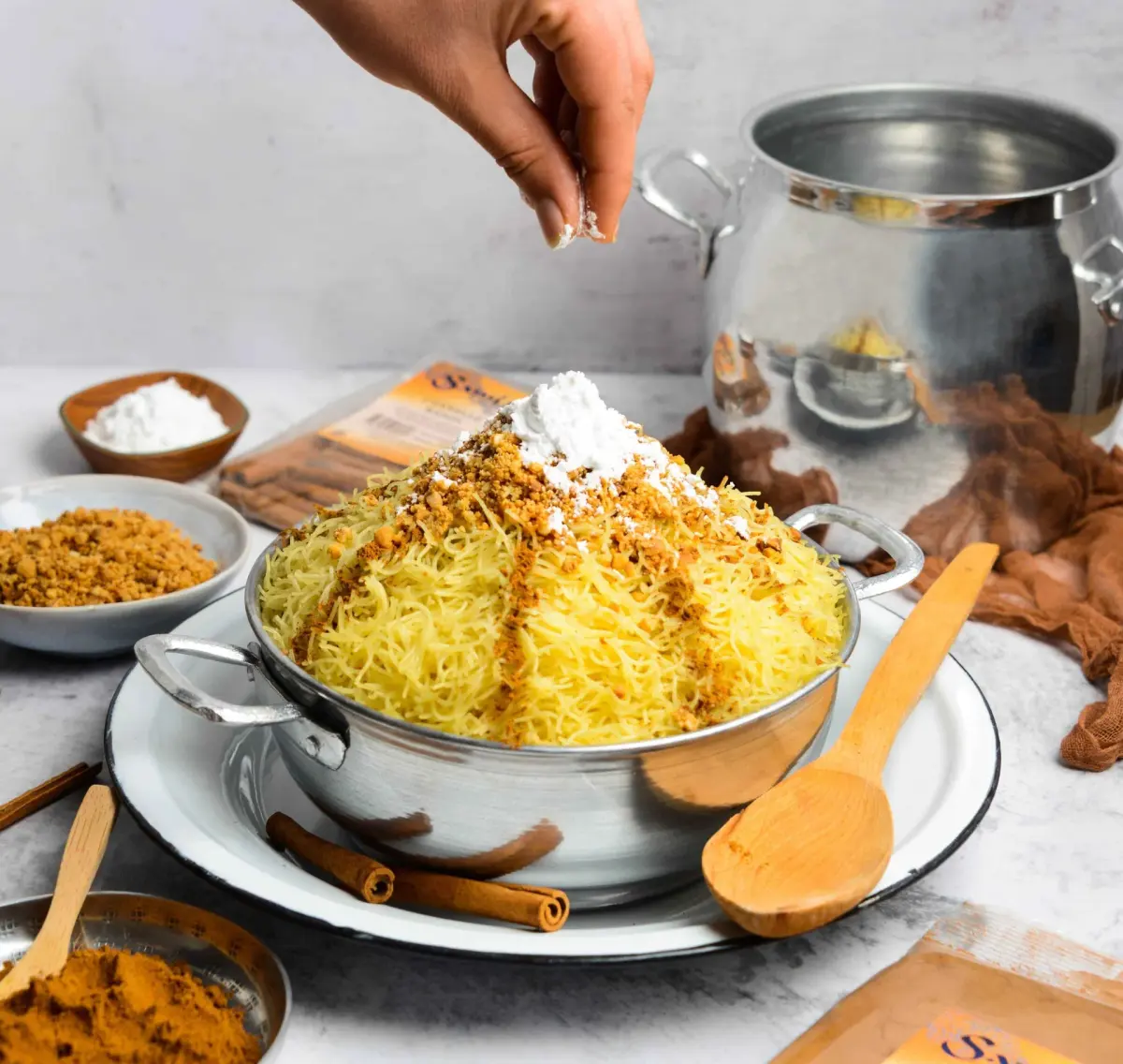 Seffa medfouna, saffron chicken buried under sweetened vermicelli with almonds