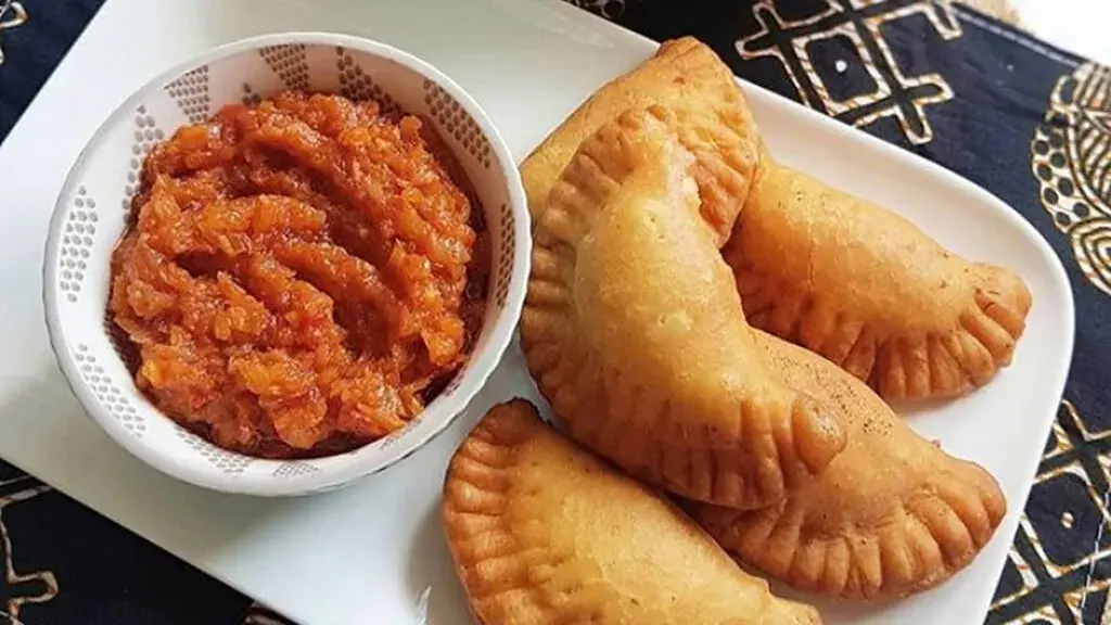 Senegalese fataya, half moon pastries filled with fish and fried until golden
