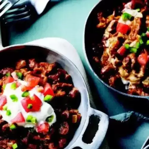 Shahan ful, fava beans with berbere topped with yoghurt, tomato and chilli