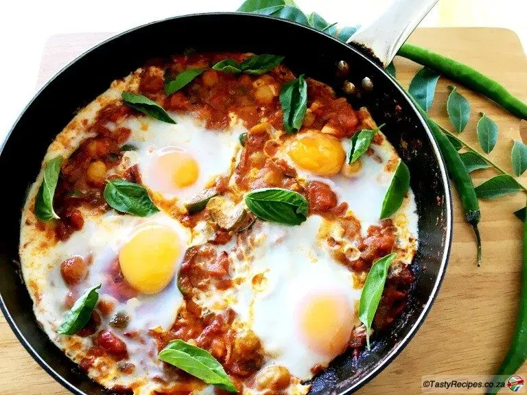 Shakshuka, eggs poached in a spiced tomato and pepper sauce