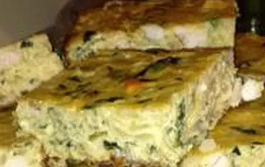 Tajin sibnekh, a Tunisian baked egg dish with chicken, potato, spinach and harissa