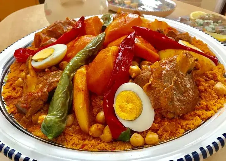 Tunisian couscous, steamed semolina served with lamb, turnips, carrots, courgette and chickpeas in a harissa broth