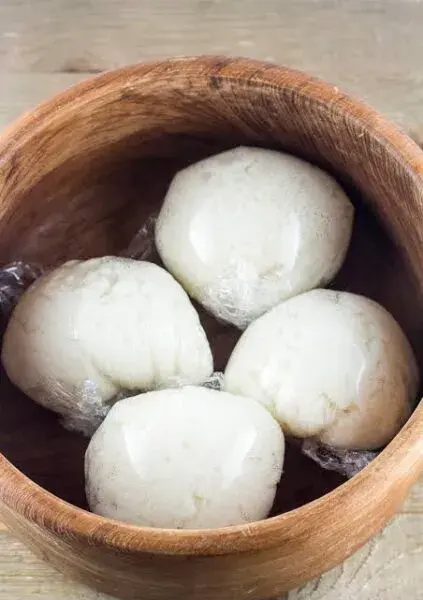 Tuwon masara, a Northern Nigerian maize swallow, moulded and served with soup