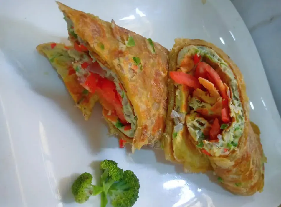 Ugandan rolex, an omelette with vegetables rolled inside a chapati and sliced
