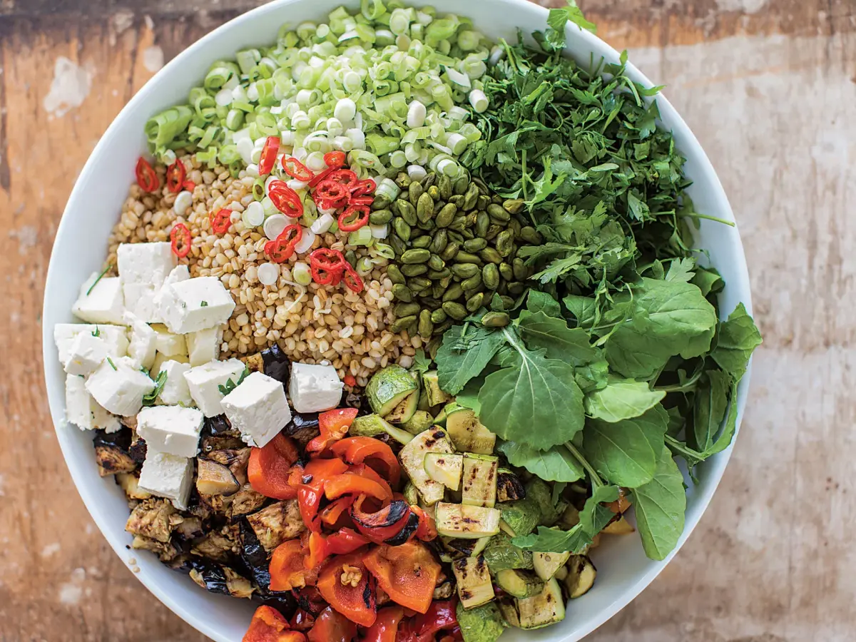 Grilled vegetable and barley salad with feta, herbs and pistachios