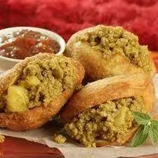 South African vetkoek, deep-fried bread rolls, split and served warm