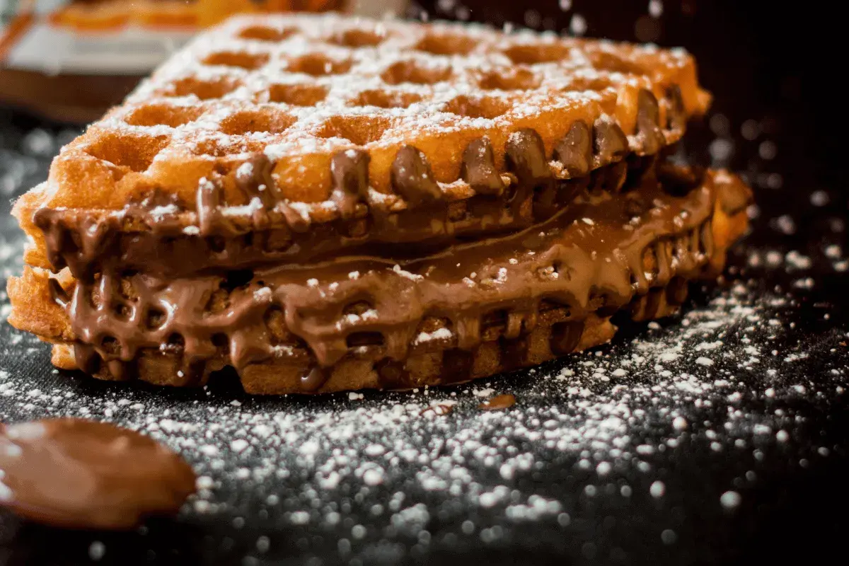 Waffle cookies cooked in a waffle iron and dusted with icing sugar
