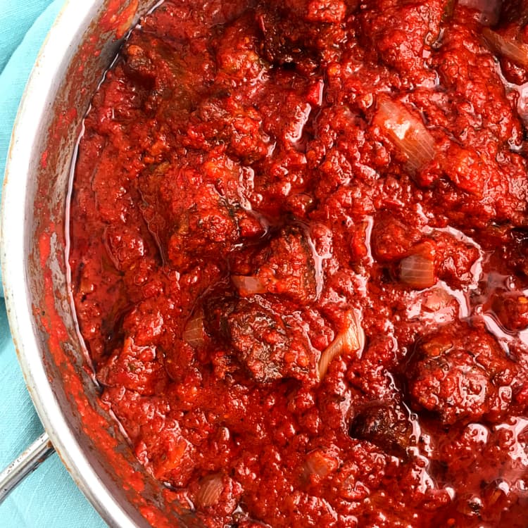 Nigerian Tomato Stew in a pot, the classic all-purpose red stew base made with tomatoes, peppers, and palm oil