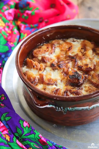 Om Ali Egyptian bread pudding served warm in a baking dish with toasted nuts and coconut, a traditional Egyptian dessert