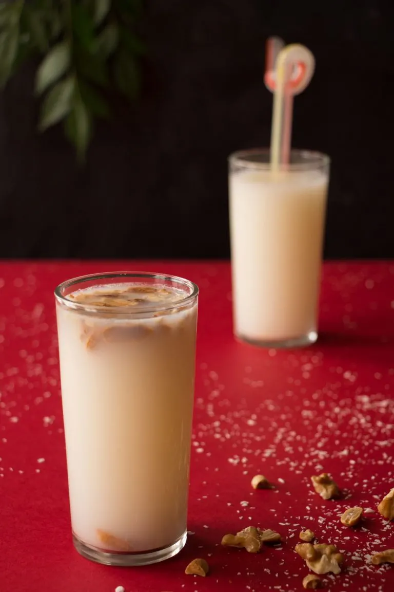 Egyptian Sobia cold coconut and rice drink in a glass with ice, a creamy sweetened Egyptian summer beverage