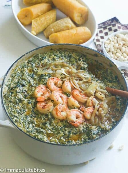 Ndole Cameroonian bitter leaf stew served with plantain and yam, Cameroon's national dish made with ndole leaves and groundnuts