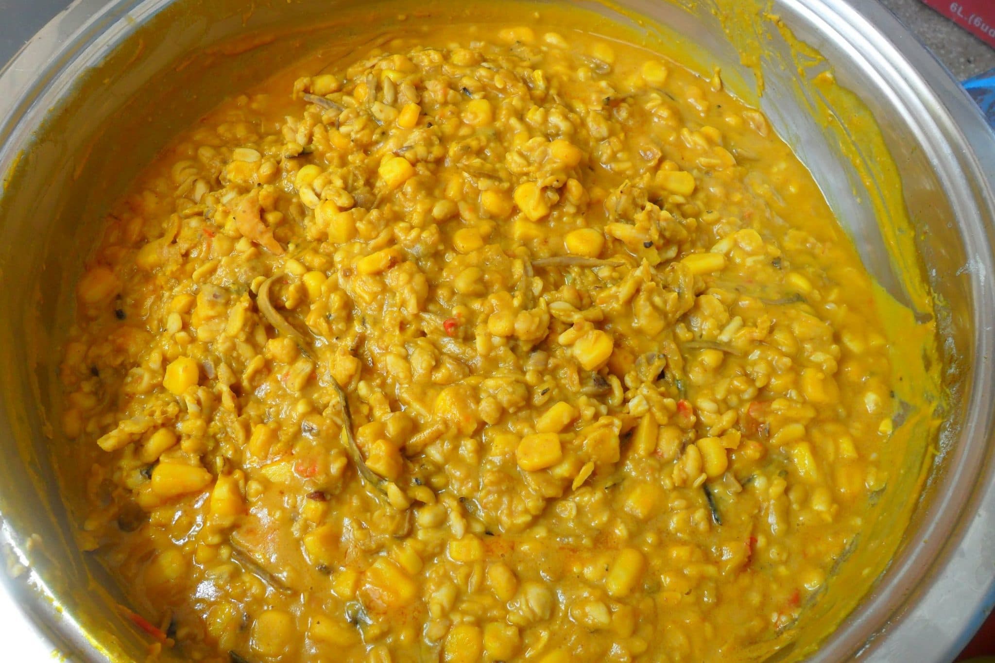 Ukwa Nigerian African breadfruit porridge in a pot, a traditional Igbo dish from southeastern Nigeria