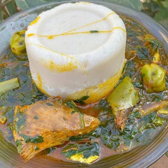 Akume Ghanaian corn dough balls served with Ademe okra sauce, a traditional Ewe dish from the Volta Region of Ghana