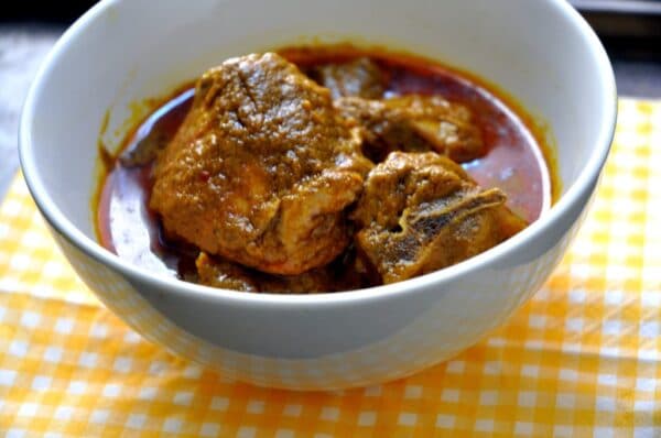Banga Soup Nigerian palm nut soup served with starch or pounded yam, a rich Niger Delta dish made with palm fruit and banga spices