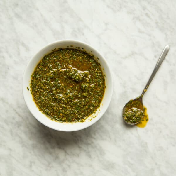 Moroccan Lamb Chops with Chermoula herb marinade served over rice with lemon, a fragrant North African grilled lamb dish