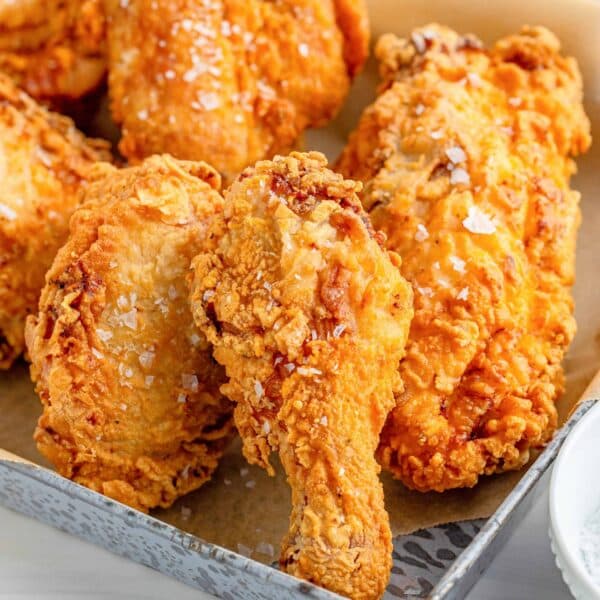 South African Crispy Spicy Popcorn Chicken golden bite-sized pieces in a bowl with dipping sauce