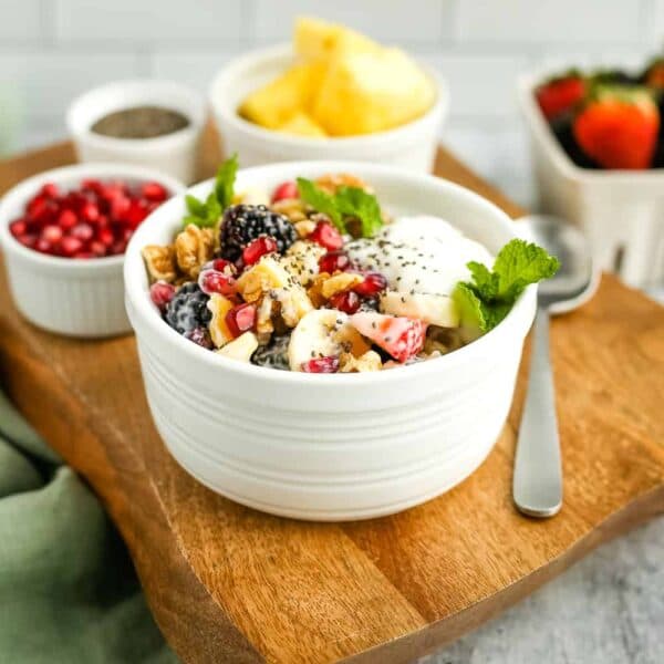 African Fruit Salad with mango, pawpaw, pineapple, and passion fruit in a bowl, a refreshing tropical dessert